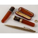 A mid 20th century 9ct gold pen, together with a c