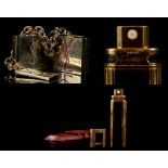 CARTIER REFILL PERFUME ATOMISER, gilt metal and black enamel with red leather pouch, 9cm long, and a