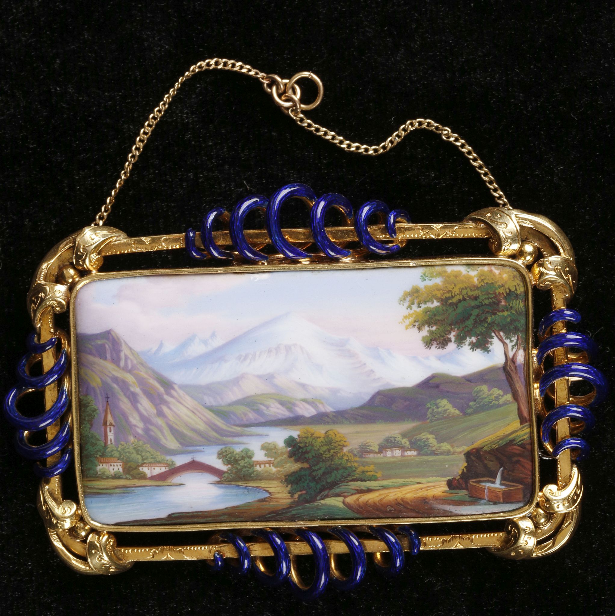 A yellow gold and enamel brooch of rectangular form, set painted image of mountainous scene, the