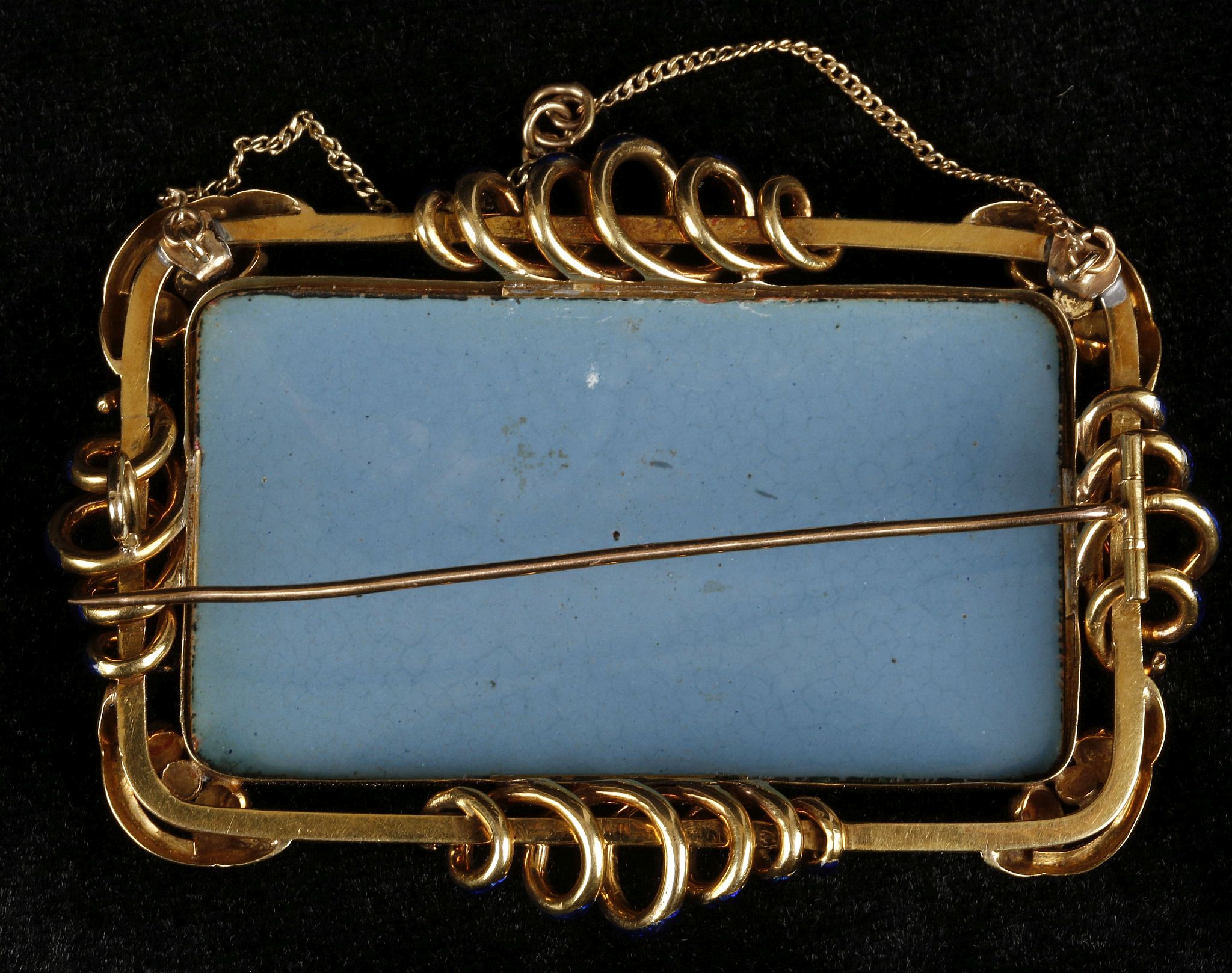 A yellow gold and enamel brooch of rectangular form, set painted image of mountainous scene, the - Image 3 of 3
