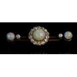 A yellow metal, diamond, and opal cluster bar brooch, set three round cabouchon opals, the
