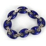 An 18 carat white gold, diamond, and dark blue enamel bracelet, set alternating diamond set and