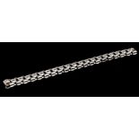 An 18 carat white gold and diamond articulated bracelet, weight 25.3g