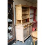 A late Victorian pine kitchen dresser, with shelves over two drawers and cupboard base.