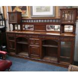 A Victorian Howard & Sons oak chiffonier with low mirrored back, stamped to right hand drawer.