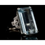 An 18 carat white gold, platinum, diamond, and aquamarine ring, in the Art Deco taste, set large