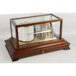 A contemporary barograph by Russell of Norwich, this brass drum barometer with inks and fresh