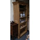A late Victorian six section pine bookcase, raised on bracket feet, 198cm high x 8cm wide.