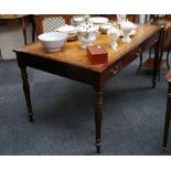 A 20th century library table in Regency style, later caramel leather and embossed insert, cross-
