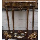 A carved and giltwood marble topped, deep serpentine form console table sold together with gilt