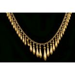 A 14 carat yellow gold fringe necklace, hung tapered pendants. Weight, 26.9g