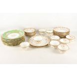 Ten Coalport porcelain dessert plates, pattern X2219, all having green border with raised gilt