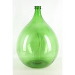 A mid 20th century ornamental green glass bottle,