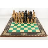 A 20th century, ornamental chess set of mother of