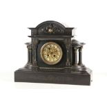 A late 19th century mantel clock, black marble and