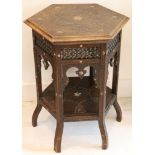 A Moorish influence lamp table, hexagonal carved top, spindle panels with ivory detail, niche open