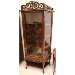 A 20th century Chinese hardwood display cabinet, with single glazed door and undertier, 195x 100x