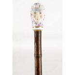 A fine 19th century bamboo vanity walking stick, the handle modelled in the Baroque taste with