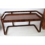 A French Art Deco style contemporary desk, macasser wood, swept integral guard rail to legs, twin