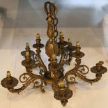 A 5 branch gilt brass Rococo hanging electrolier, each scrolling branch supporting upper and lower