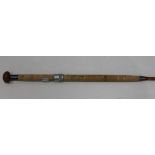 A vintage 'Hardy Bros' 12ft 3in salmon fishing rod with cork handle and generic rod bag.