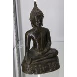 A Thai seated bronze Buddha, 17cm high.