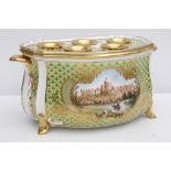 A Buckingham Palace porcelain bough or bulb pot, decorated with a view of Windsor Castle, within a