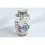 A Chinese Republican style famille rose figurative vase, 22cm high.