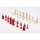 A 19th century Canton carved ivory chess set in white and red, height of king 8.5cm, contained in