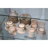 An early 20th century Japanese Taisho period earthenware part tea service, with traditional