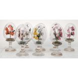 A set of eight Austrian glass egg decorations, each set with enamel centres of flowers, 15cm.