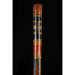 AN INDIAN PAINTED STAFF. A long and painted Indian staff, decorated in red, black and yellow,