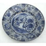 A Chinese 'Kraak porcelain' blue and white charger, Ming Dynasty, 35cm diameter.