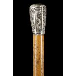 A CHINESE EXPORT SILVER MOUNTED CANE. The silver knop decorated with prunus blossom, bamboo, a three
