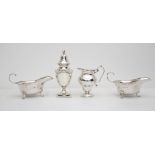 A pair of silver sauce boats, floral edges, trefid feet, Birmingham 1904, cream jug with scallop