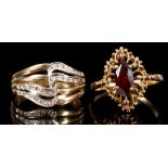 A 9 carat yellow gold and garnet ring, the single marquise stone set in a raised openwork mount,