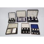 Two silver Vesta cases and a postage stamp 'envelope', assorted cased cutlery and silver