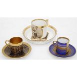 A 19th century Vienna coffee can and saucer, painted en-grisaille and two others later (3).