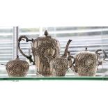 An Austro Hungarian .800 silver four piece tea set with rococo decoration.