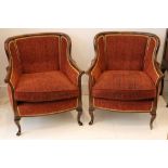 A pair of mahogany frame study chairs, buttonback, scroll arms, cabriole legs.