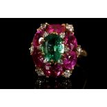 Bulgari. An 18 carat yellow gold, pink sapphire, emerald, and diamond floral cluster ring, set six