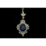 An 18 carat white gold, diamond, and sapphire pendant, set natural sapphire of approx. 4.60 carats