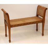 A window seat in painted French style, scroll wings, double rattan panels, 102cm wide.