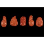 A collection of five carved coral plaques depicting stylised faces. L: 3.5cm Weight (combined): 36.