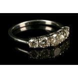 An 18 carat white gold and diamond graduated five stone ring, the diamonds of approx. 1.0 carat
