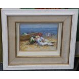 Oil on panel depicting a beach scene with figures relaxing by a boat, 19 x 24cm.