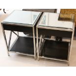 A pair of retro style occasional tables constructed in stainless steel with bevelled mirrored tops