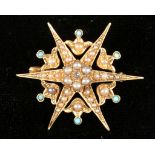 An Edwardian yellow gold, split seed pearl, and turquoise starburst brooch, having central diamond