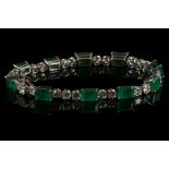 An 18 carat white gold, diamond, and emerald bracelet, set ten emeralds of approx. 11 carats