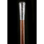 A RUSSIAN SILVER TULLA AND HARDWOOD CANE. The nicely decorated 'Milord' handle on a shaft that
